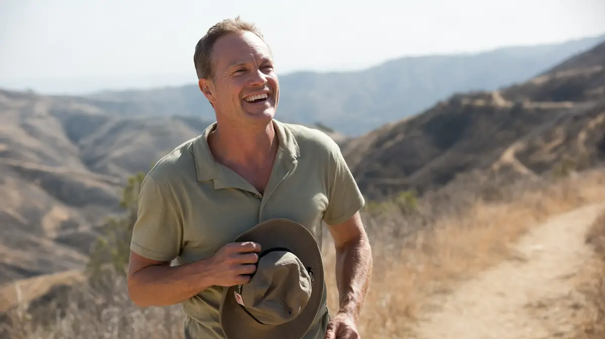 Smiling man on a sunny foothill trail