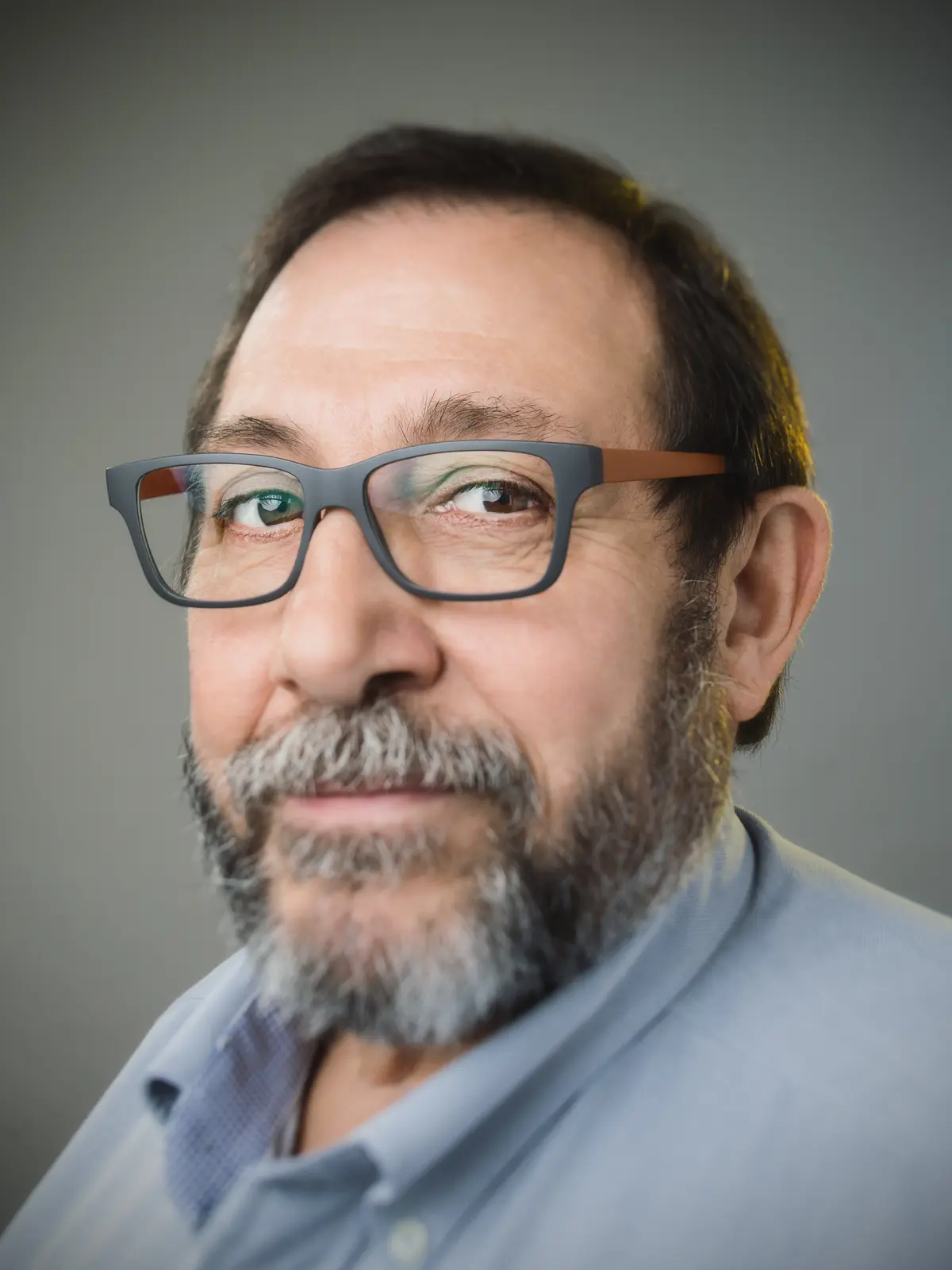 Close portrait of an older man in glasses