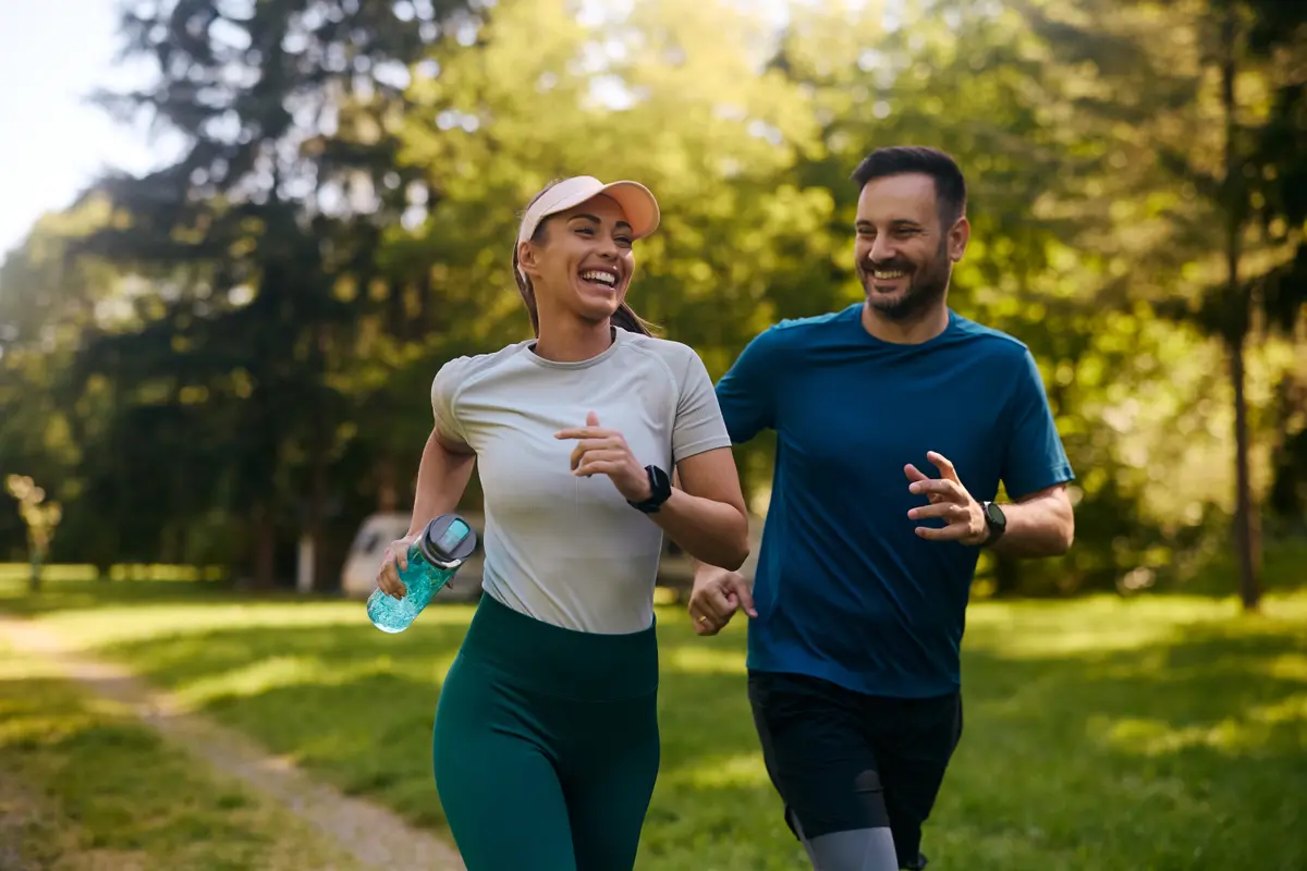 Couple running together in a park