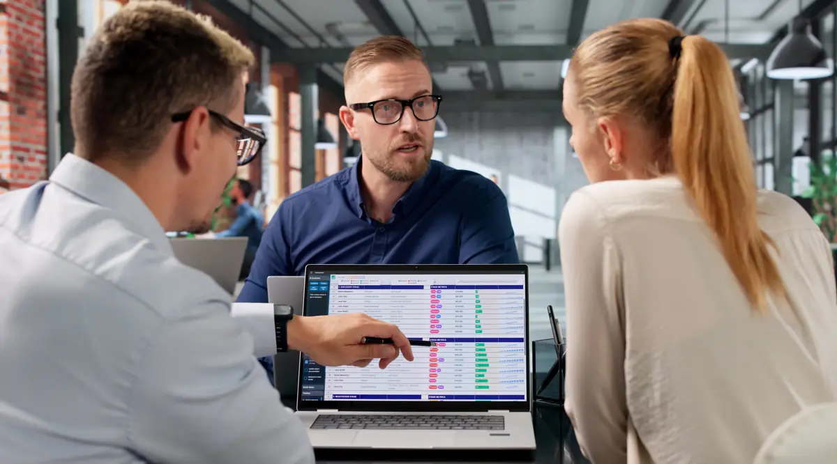 Doctor walking patients through results on a laptop