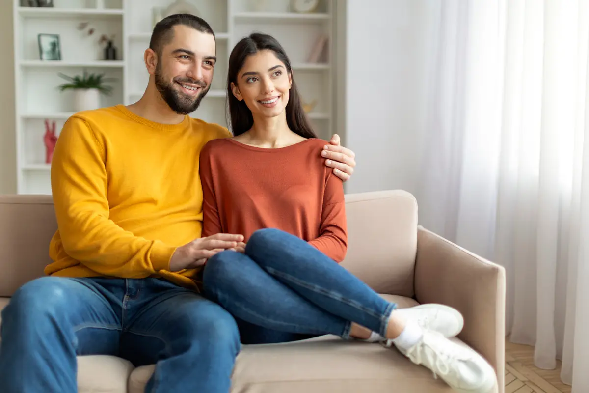 Happy couple relaxing on a couch