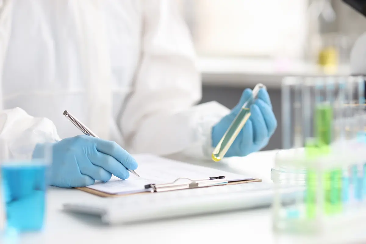 Lab technician recording results