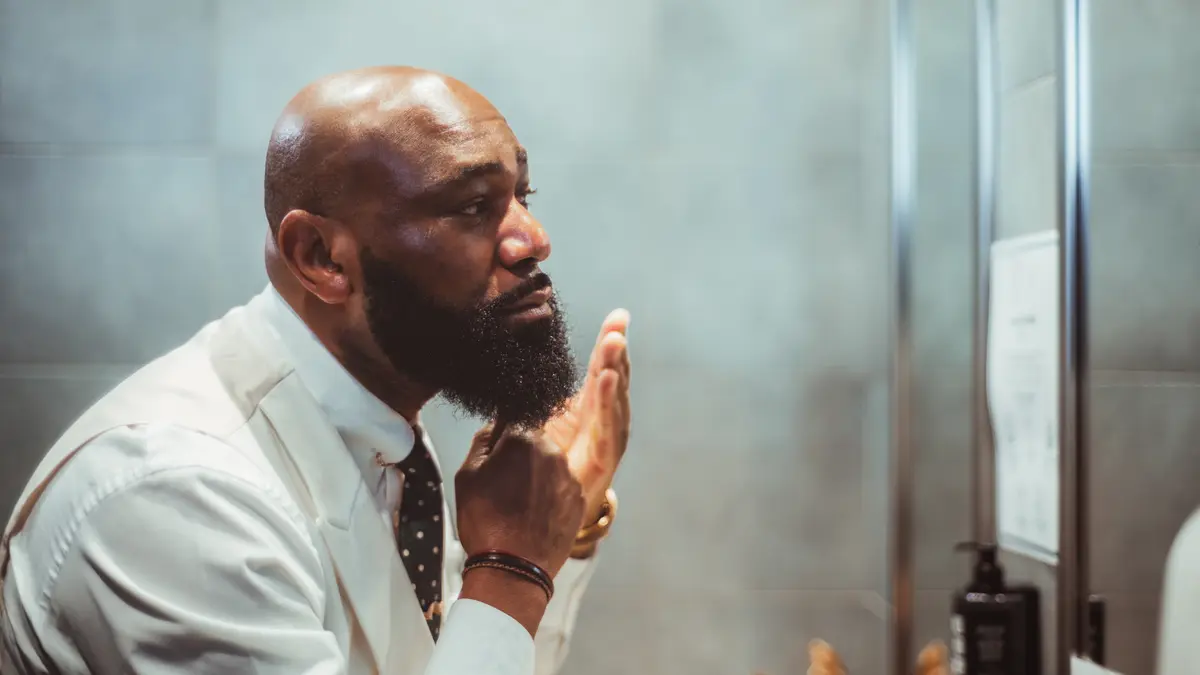 Man grooming his beard