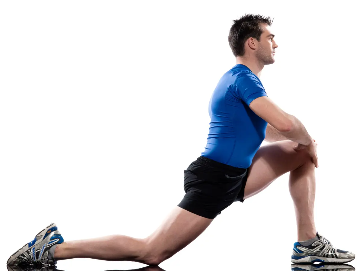Man in a lunge stretch before exercise