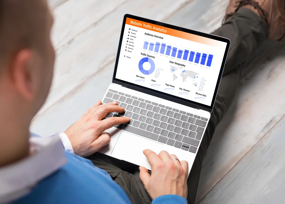 Man reviewing a health dashboard on a laptop