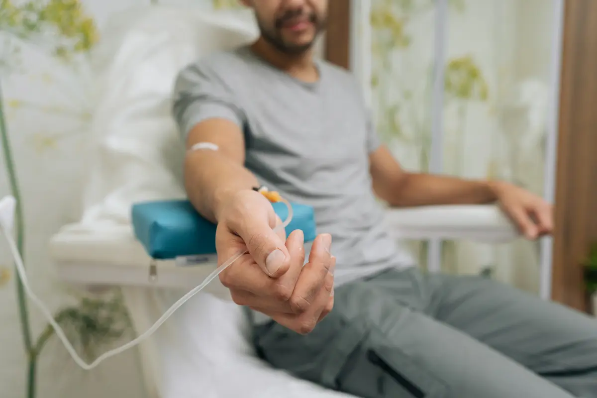 Man with an IV line in his arm