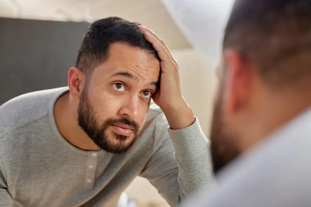 Man worried about his thinning hair