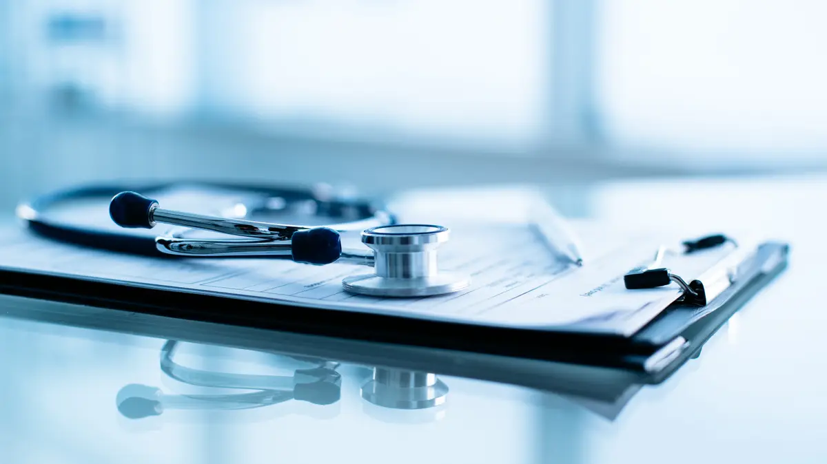 Stethoscope resting on a medical chart