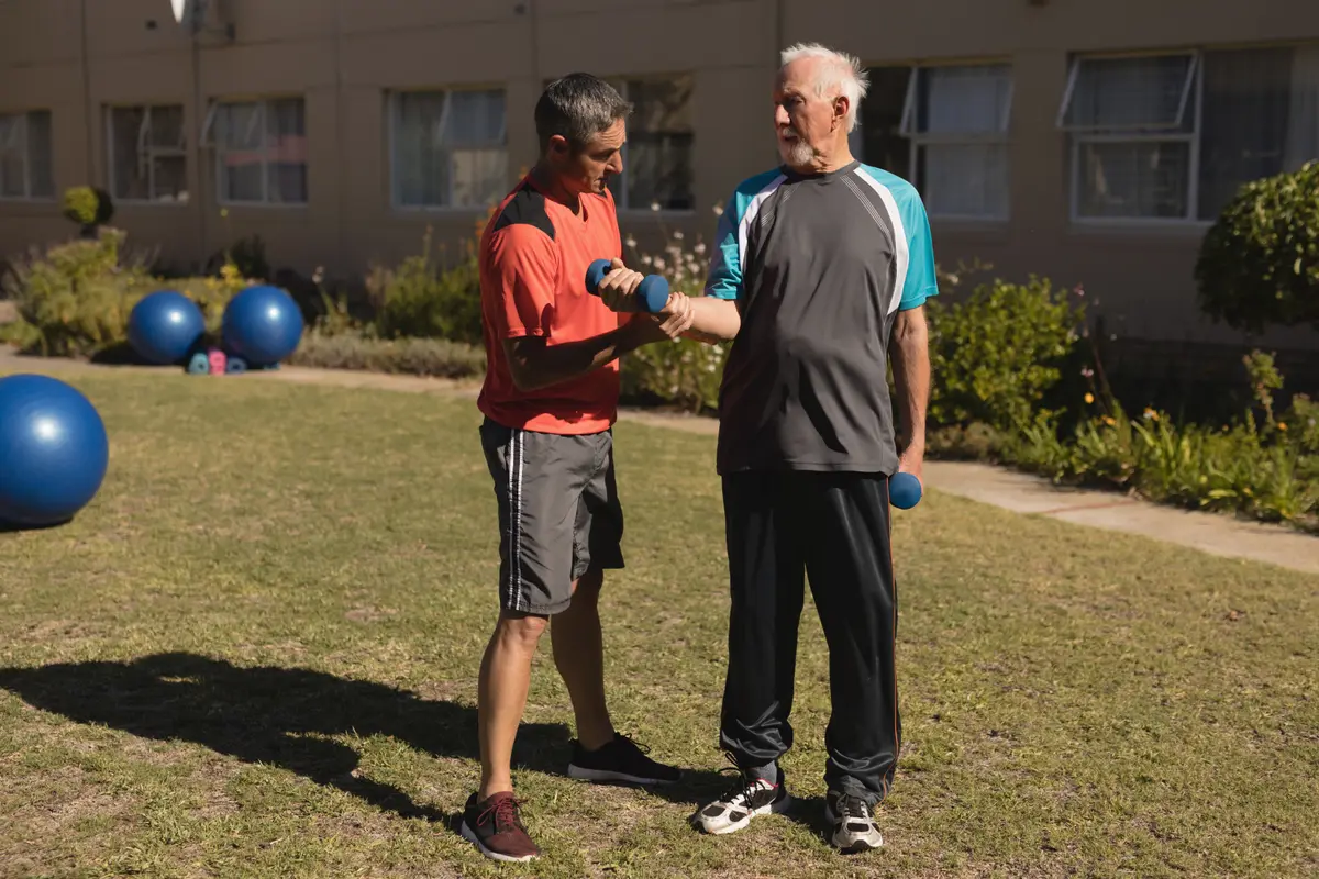 Two men exercising together outdoors