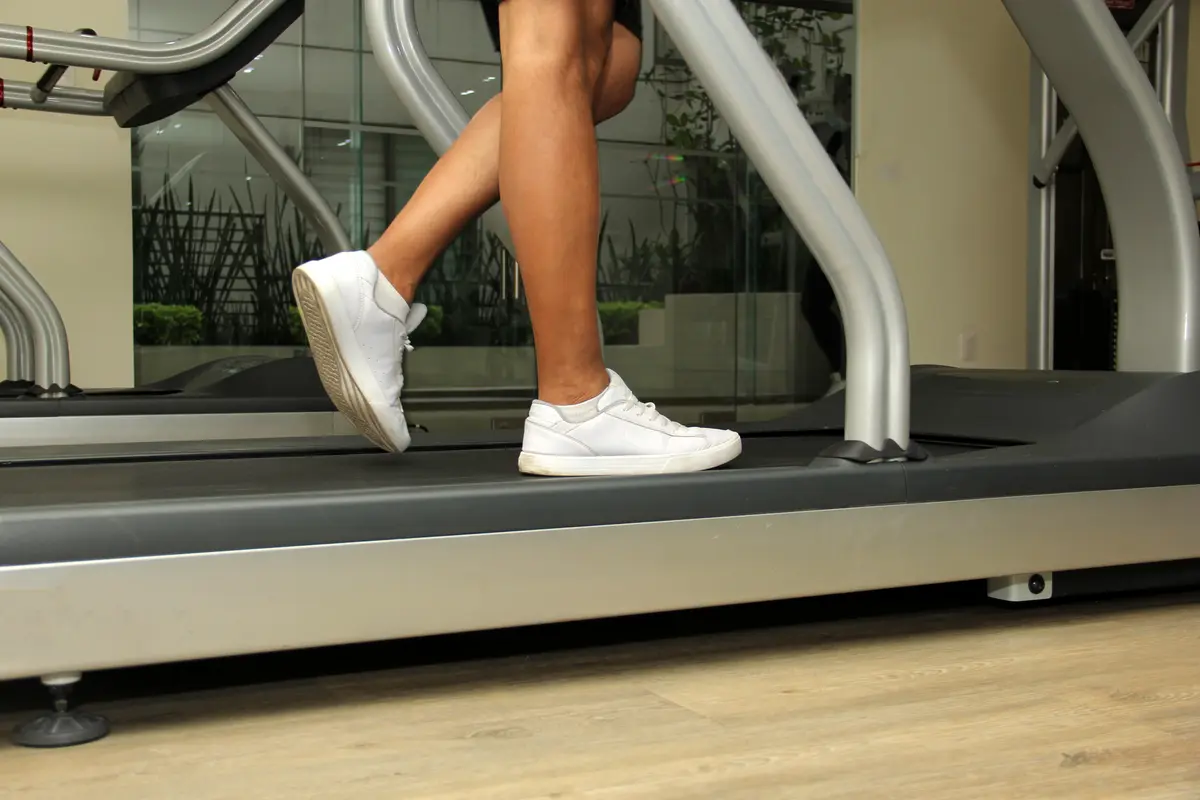Walking on a treadmill, close view of shoes