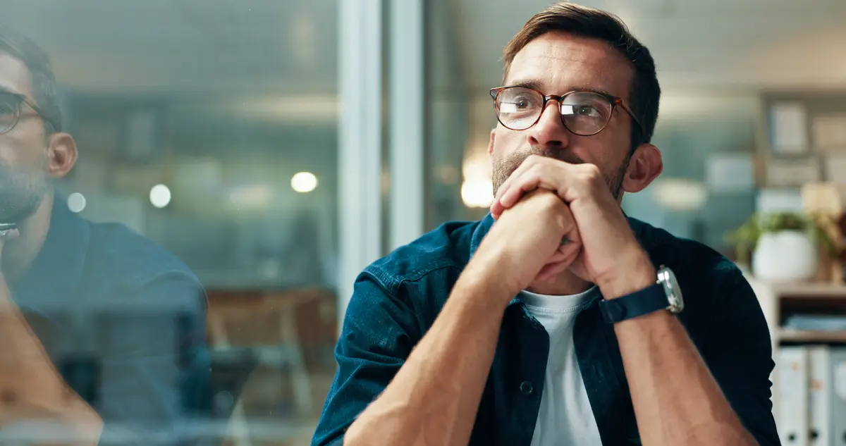 Worried man with his hands over his mouth